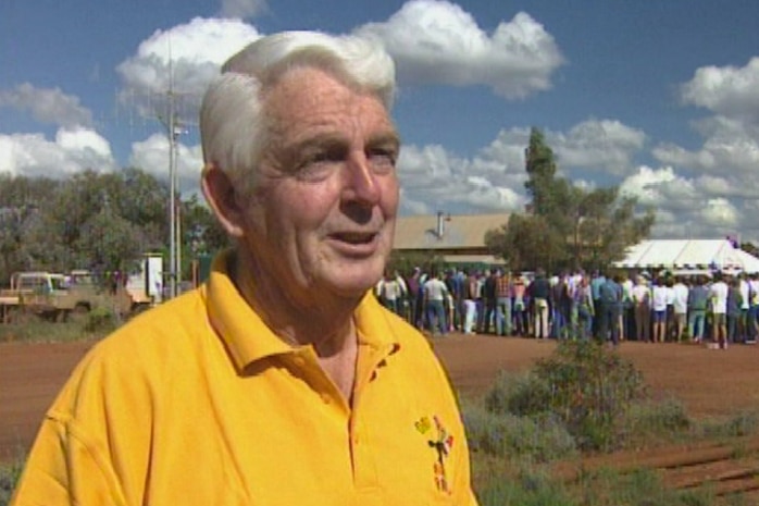 A head and shoulder sshot of Don Hancock wearing a yellow shirt standing in front of the Ora Banda pub.