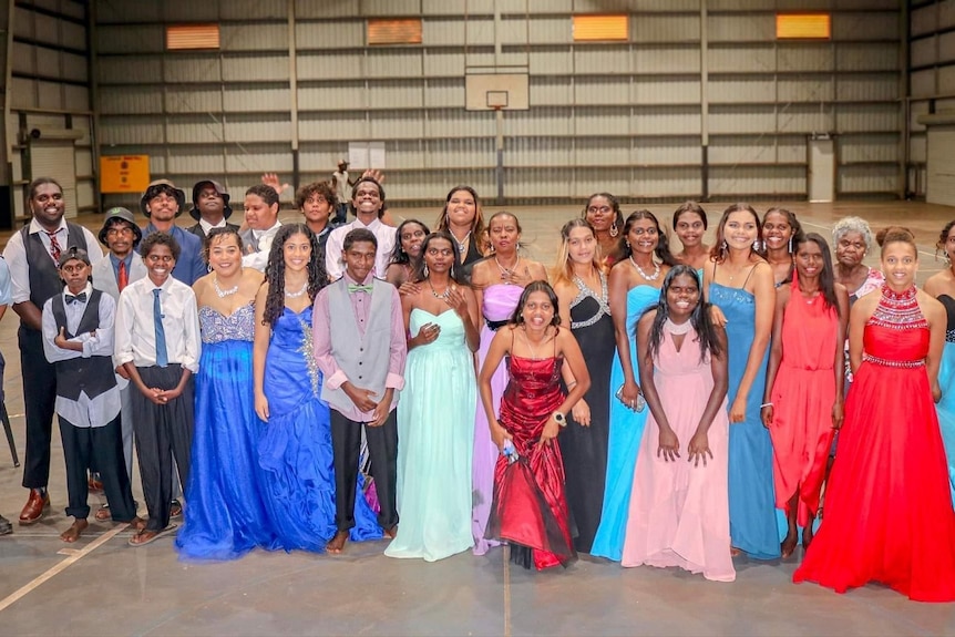 Group of young people dressed in formal fashion for Aurukun NAIDOC Ball.