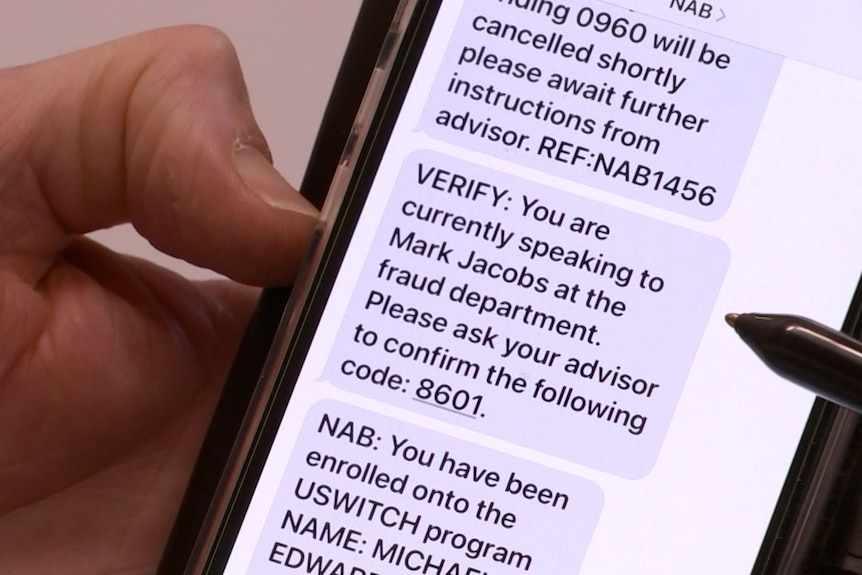 Text messages shown on a mobile phone held in the palm of a hand
