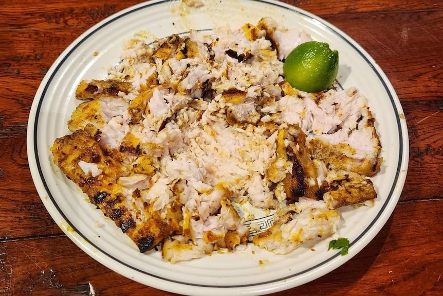 A plate of cooked fish.