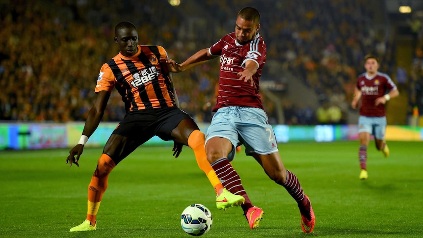 Hull's Diame contests the ball with West Ham's Reid