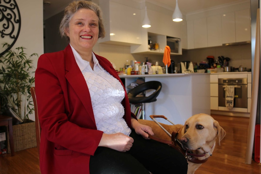 Amanda laughs, her dog beside her.