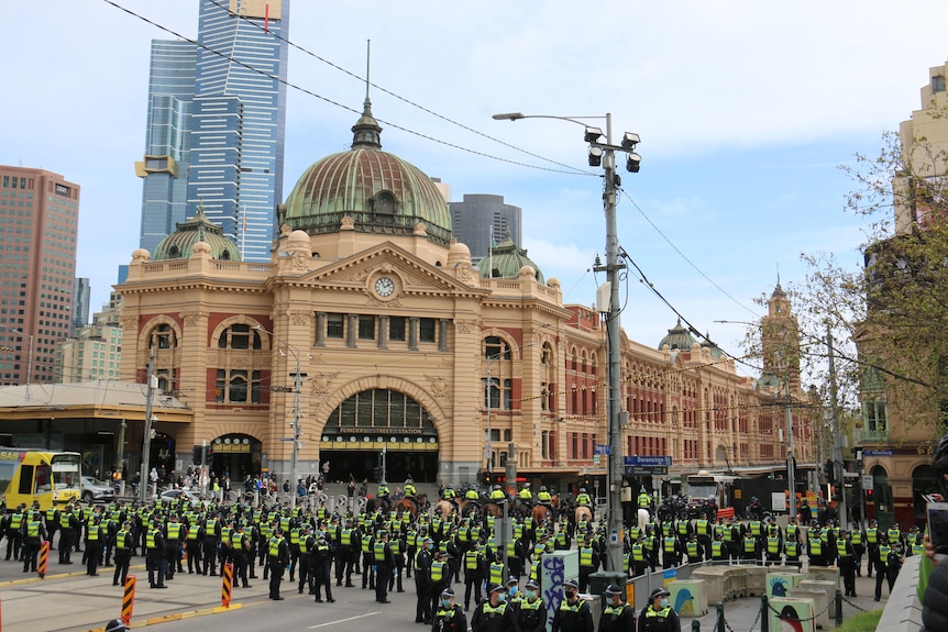 Police officers blocking a CBD intersection