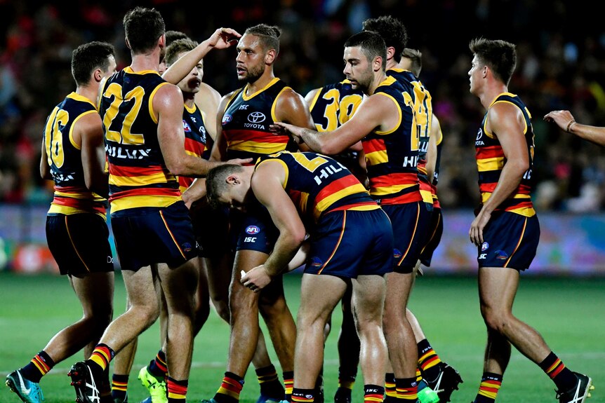 Adelaide players celebrate a goal