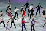 A group of ice skaters perform together at the Winter Olympics.
