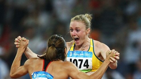 Sally McLellan celebrates wildly with bronze medallist Canadian Priscilla Lopes-Schliep.