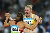 Sally McLellan celebrates wildly with bronze medallist Canadian Priscilla Lopes-Schliep.