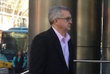 Barry Wells arrives at court, he is accused of organising contracts worth $25 million for the PTV.