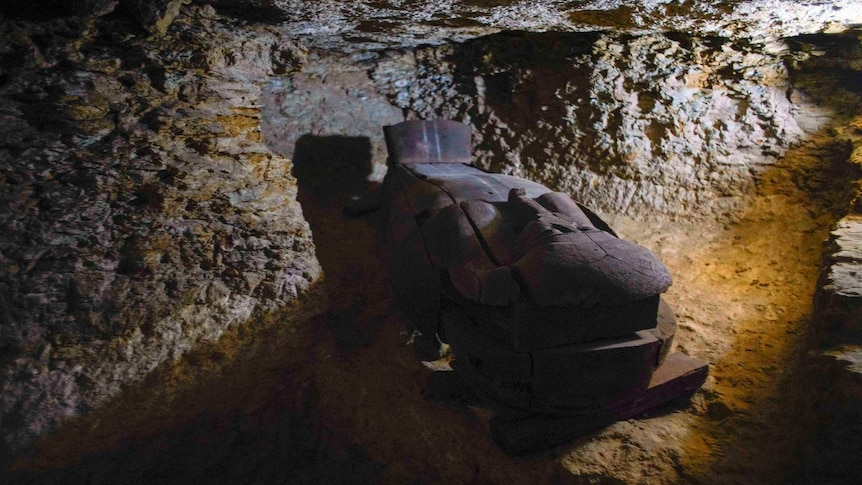 Wooden coffin in a shaft