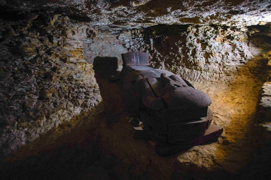 Wooden coffin in a shaft