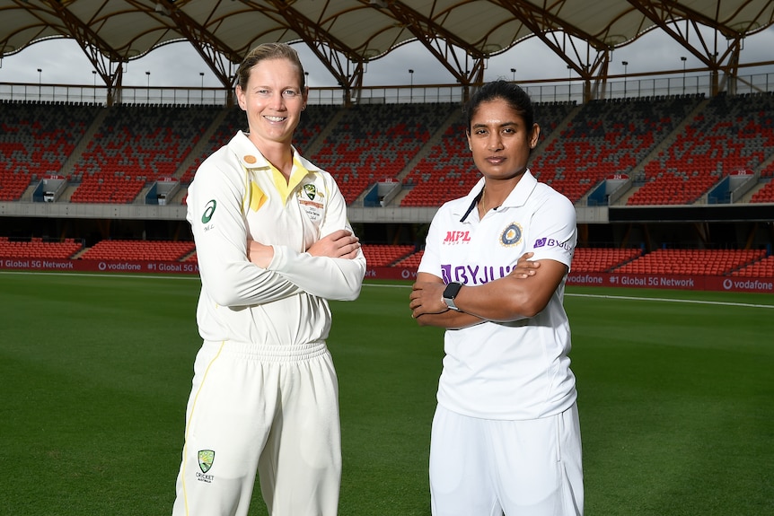 Meg Lanning and Mithali Raj stand with their arms folded in the middle of Carrara Stadium