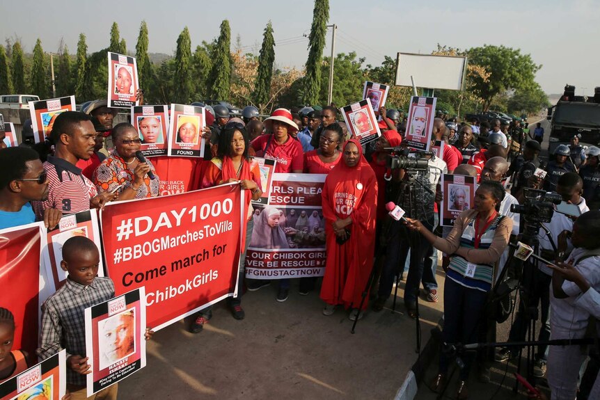 Police disrupt a rally by the #BringBackOurGirls campaign.