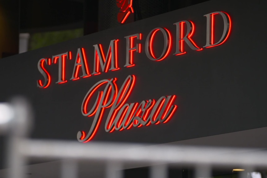 A red and black electrical sign saying STAMFORD Plaza