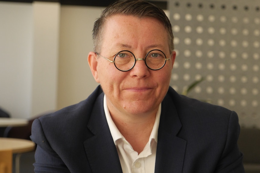 A close-up of Jill Prior who is wearing a navy blazer.