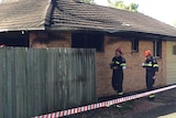 Fire investigators at scene of fatal Coolum Beach house fire where a 44-year-old woman died.