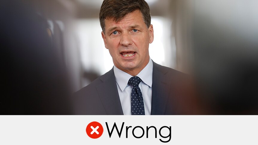Angus Taylor speaking at a press conference. The verdict is "wrong" with a red cross