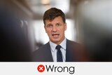 Angus Taylor speaking at a press conference. The verdict is "wrong" with a red cross