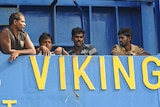 Sri Lankan asylum seekers stand on the deck of the Oceanic Viking