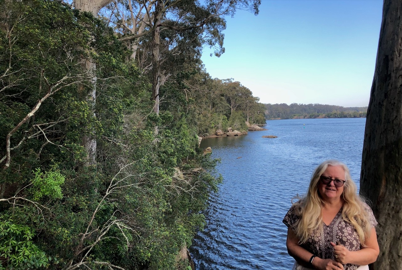 woman and the river and trees