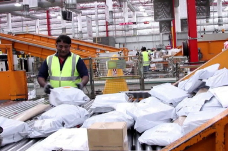 Australia Post workers sorting parcels in Melbourne