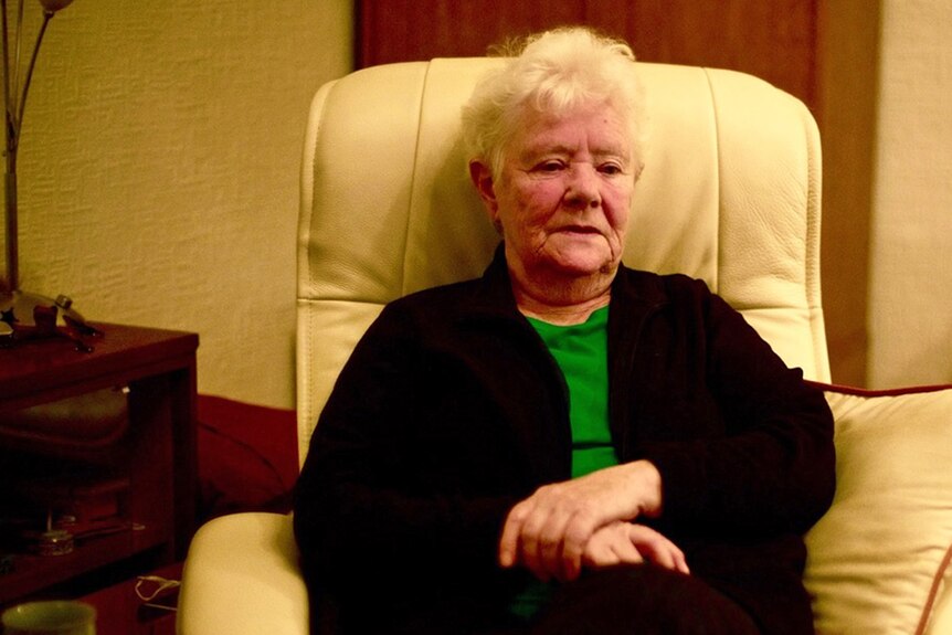 Elderly woman in a lounge chair