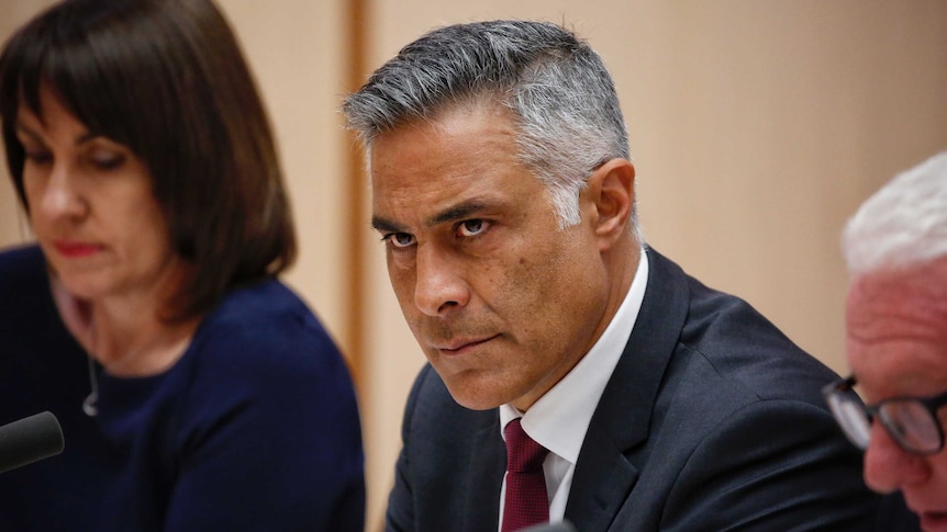 Outgoing Australia Post boss Ahmed Fahour looks stern as he faces Senate Estimates.