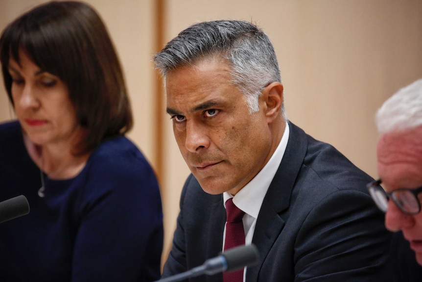 Outgoing Australia Post boss Ahmed Fahour looks stern as he faces Senate Estimates.