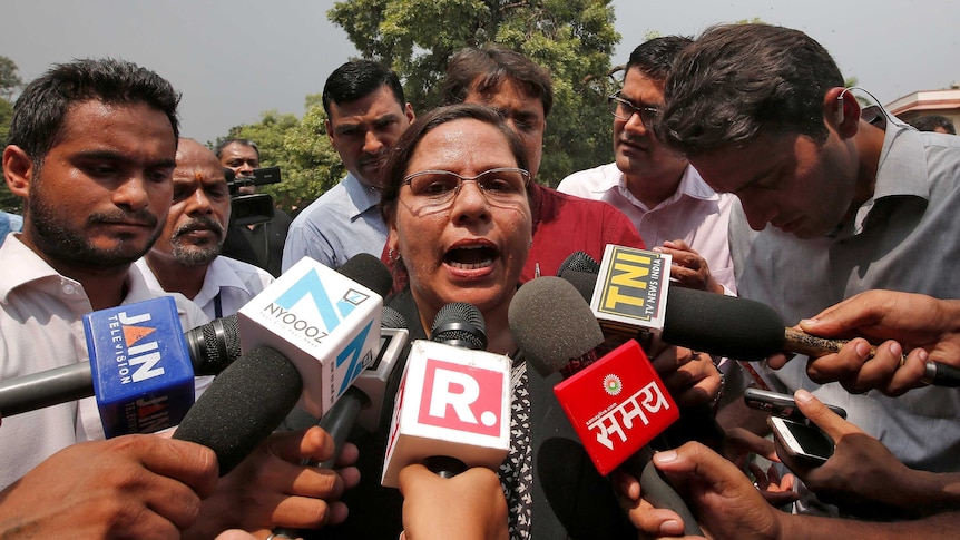 Farha Faiz, a lawyer, speaks with the media after a verdict.