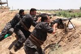 Kurdish security forces take their positions during clashes with ISIS in Kirkuk