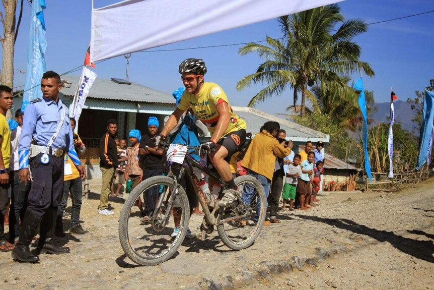 Canadian Cory Wallace wears the yellow race leader's jersey in the 2014 Tour De Timor