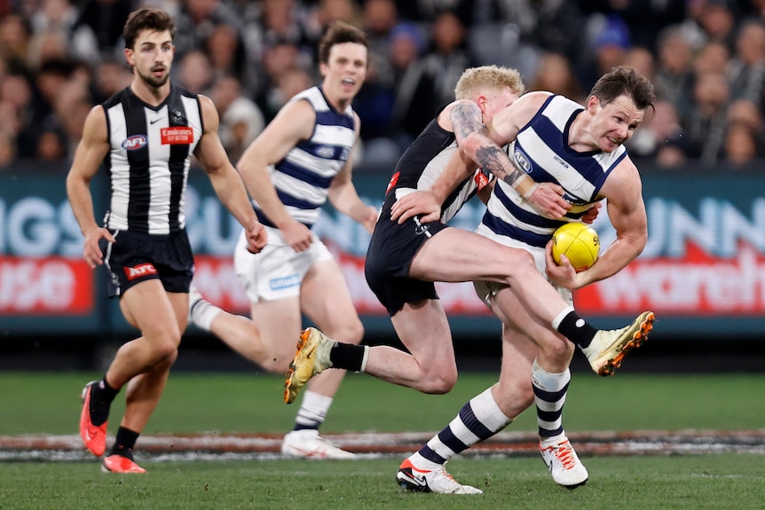 Patrick Dangerfield tackled by John Noble