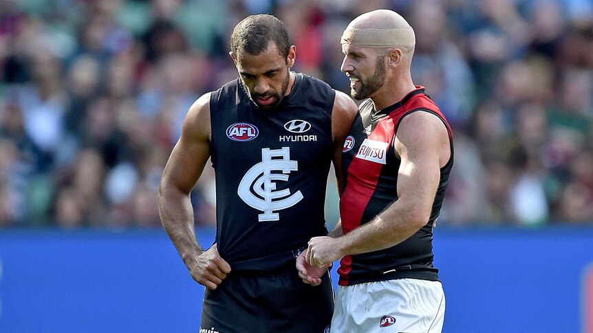 Fiery clash ... Chris Yarran (L) and Paul Chapman during Saturday's match at the MCG