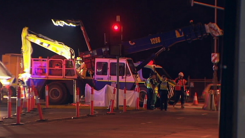 Emergency services at the scene of a crane accident.