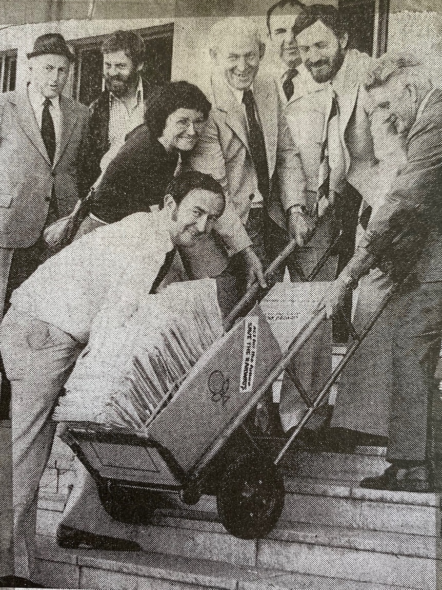 Black and white photo of train petition being delivered