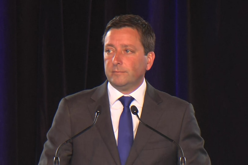 Matthew Guy at a podium.