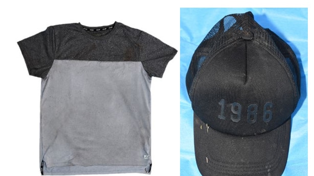 A grey shirt with black upper section is on the left. A black cap saying 1986 is on the right.