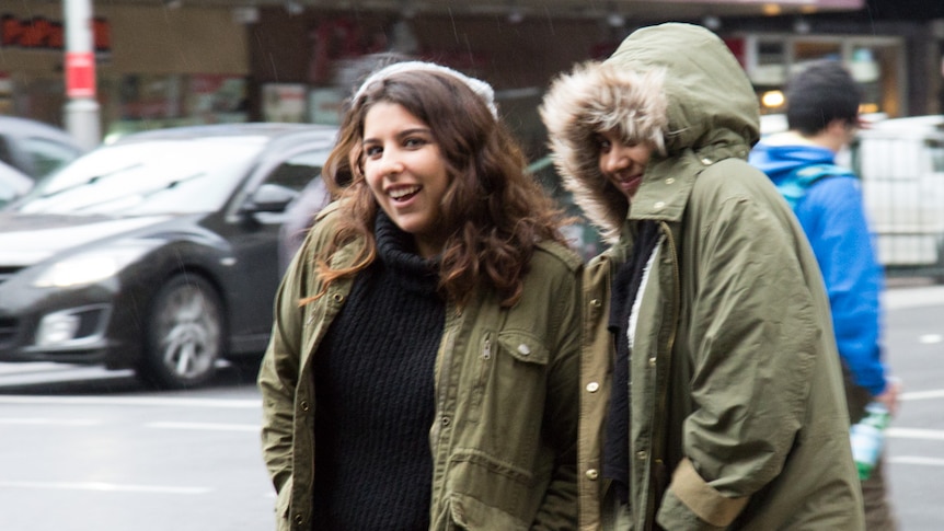 Two women rugged up