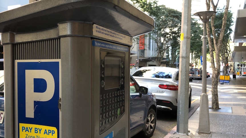 A parking meter on a city street.