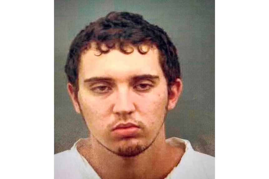 A mugshot of a Caucasian man wearing a white shirt.