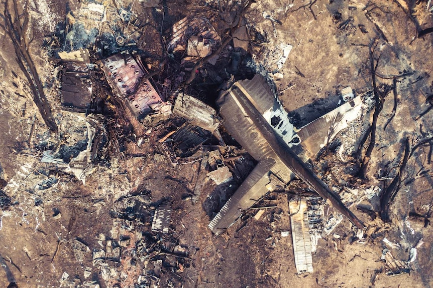 aerial view of a destroyed and burnt out plane