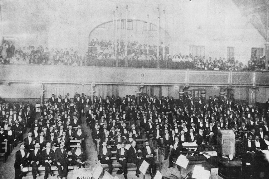 An audience photograph of a Liedertafel smoke concert held in the Exhibition Concert Hall in Bowen Hills in 1901.