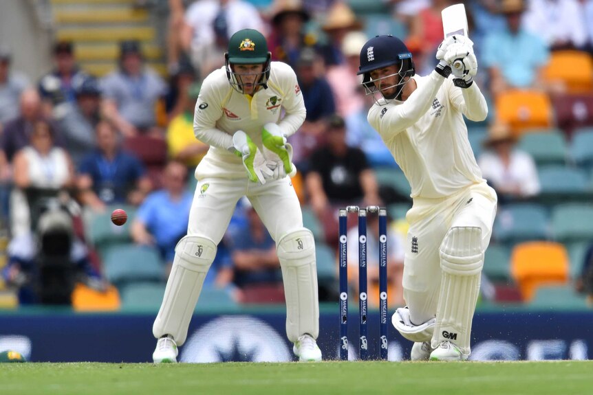James Vince (R) of England plays a shot on Day 1 at the Gabba.