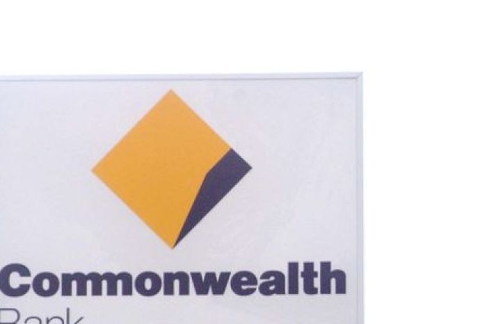 A Commonwealth Bank and National Australia Bank sign stand side by side