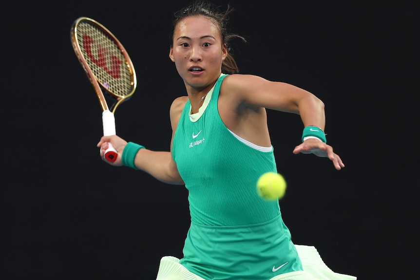 Zheng Qinwen plays a forehand in the 2024 Australian Open final.