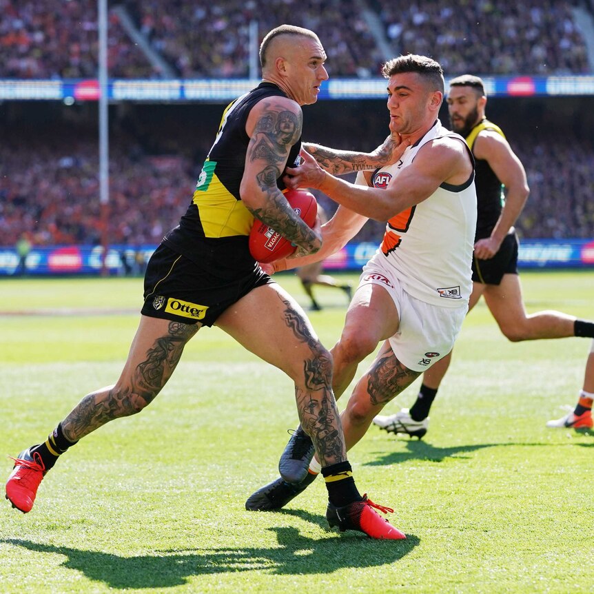 Dustin Martin gives a don't argue to a GWS player