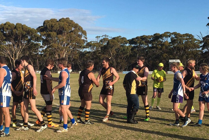 Players from the Ravensthorpe Tigers and Hopetoun Southerners shake hands during the 2017 RFDA Grand Final.