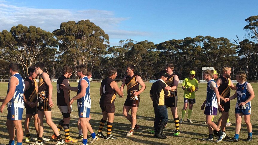 Players from the Ravensthorpe Tigers and Hopetoun Southerners shake hands during the 2017 RFDA Grand Final.