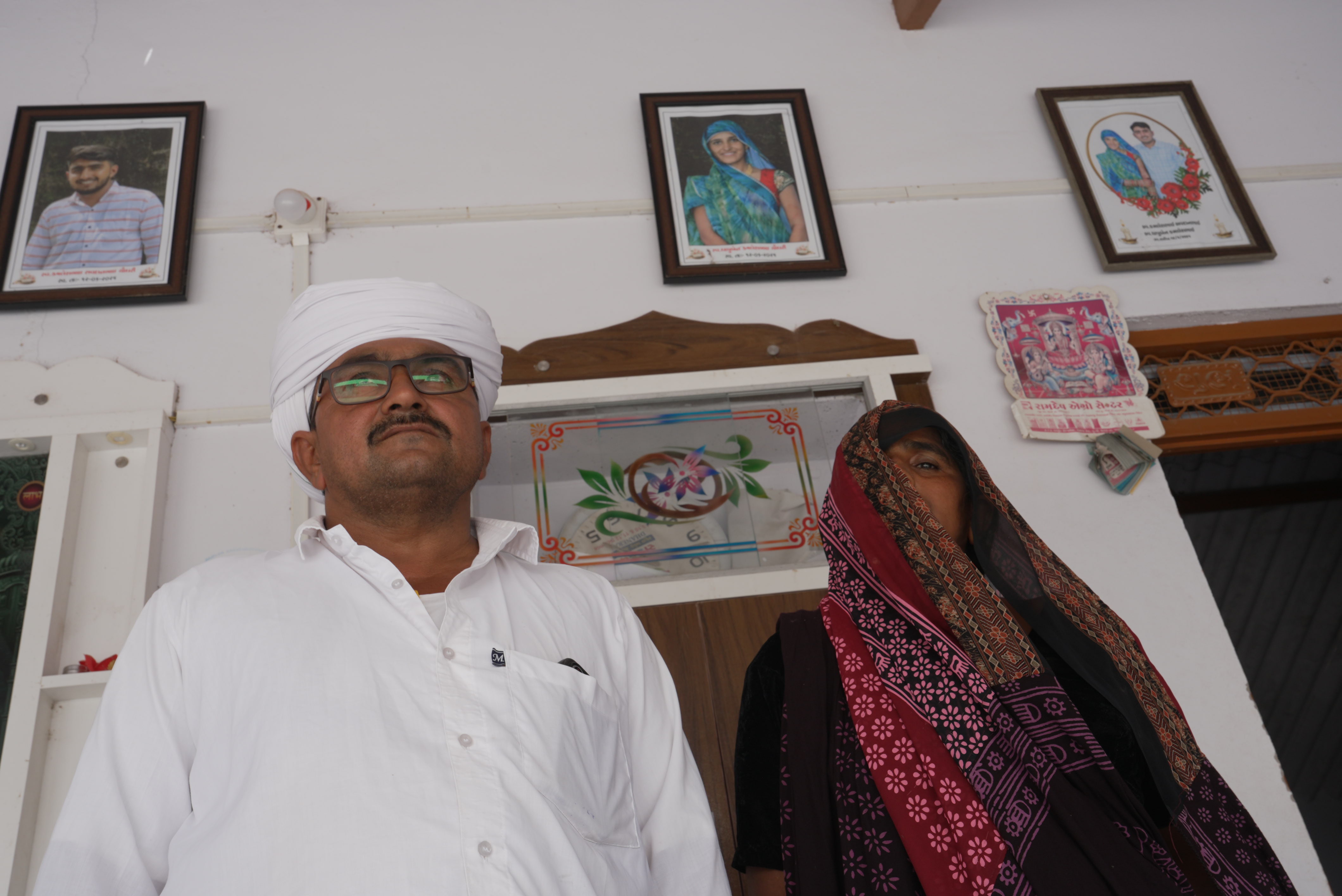 Pictures of Kamlesh and Dhapuben Chowdhary hang in the walls of the home.