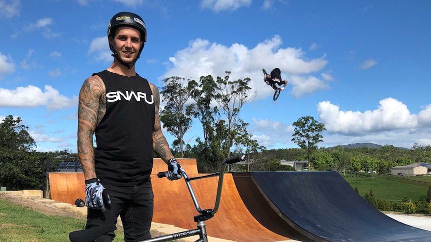 Professional Freestyle BMX rider Logan Martin in front of his backyard ramp park