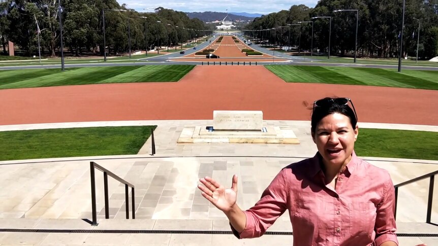 Kira Korolev stands outside the war memorial in Canberra